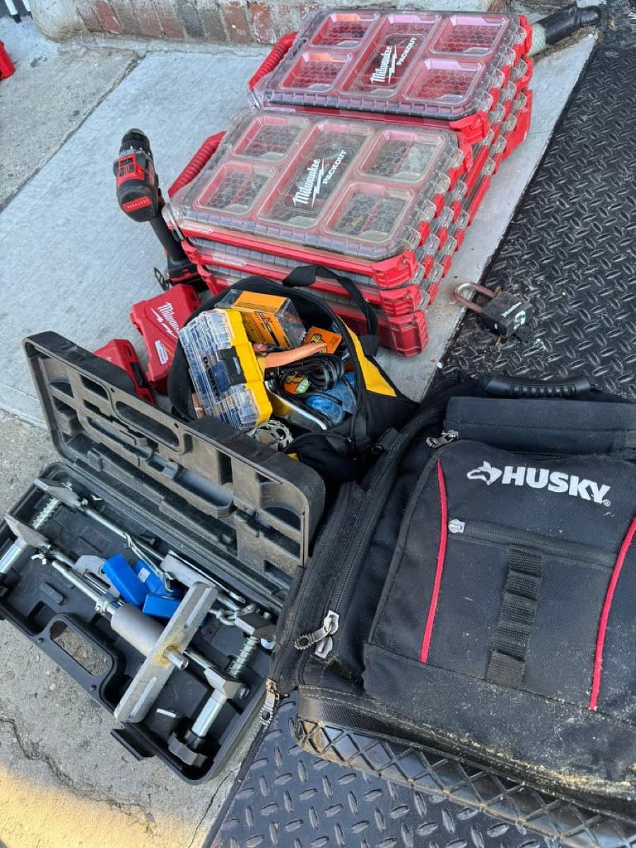 The full kit — organized tool cases on the truck gate