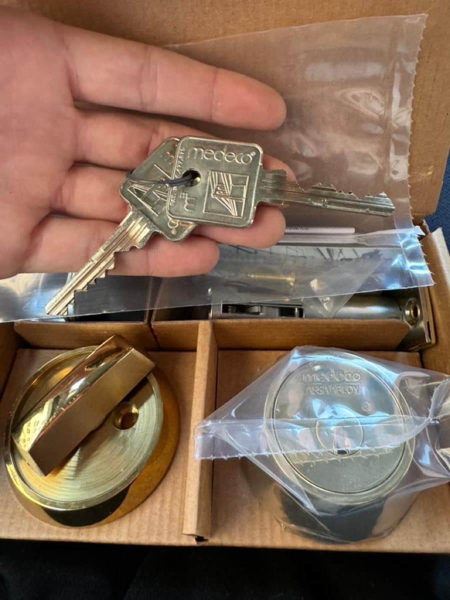 Medeco high-security cylinders and restricted keys, unboxed on site